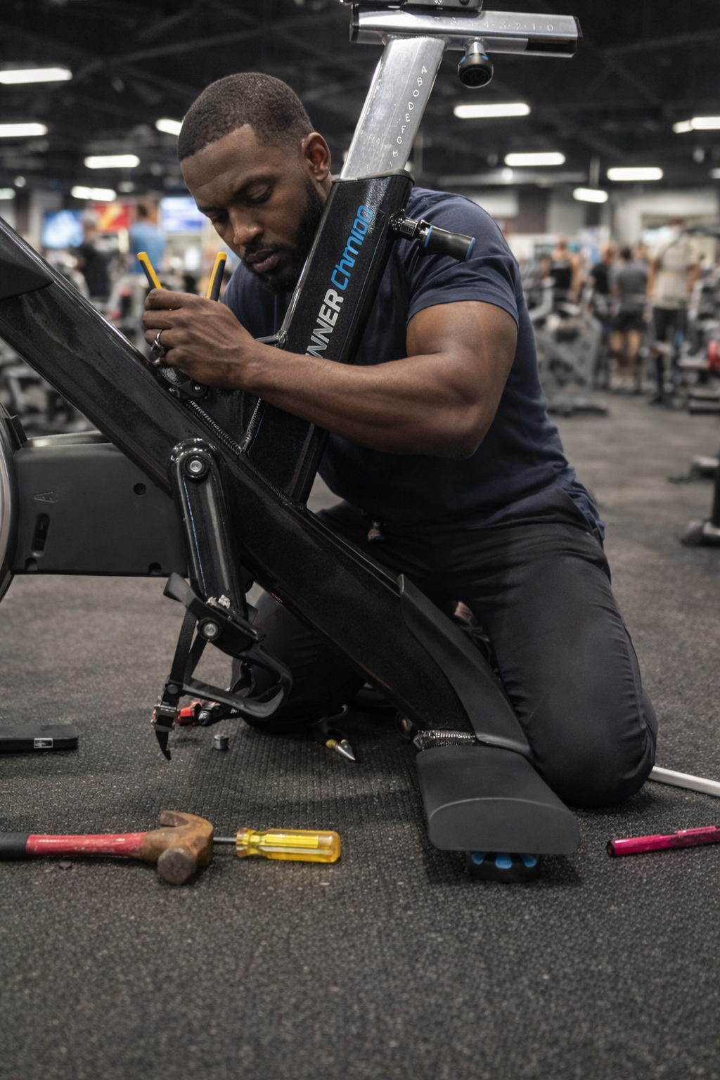 Man fixing spin bike.png