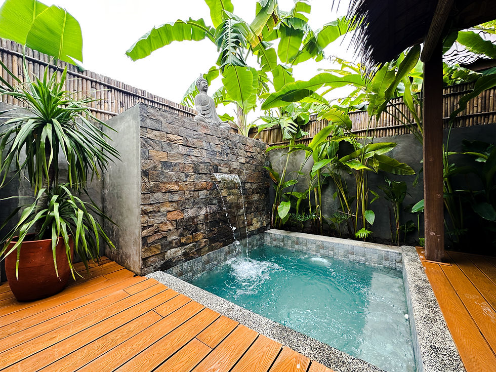 High angle view of the private outdoor Jacuzzi-type pool surrounded by lush greenery