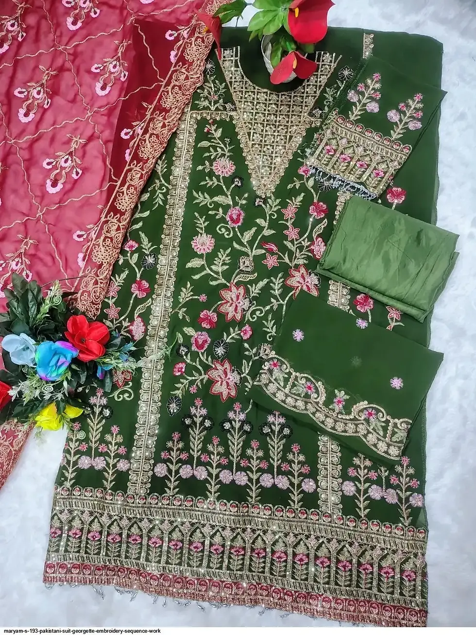 Mehreen emerald embroidered suit with pink dupatta.