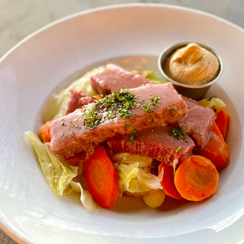 Doherty's Irish Pub & Restaurant Corned Beef & Cabbage
An Irish tradition! Corned in-house, hand sliced and laid over cabbage, potatoes and carrots and served with spicy mustard.