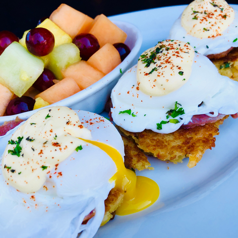 Doherty's Irish Pub & Restaurant Eggs Kilkenny
White cheddar & scallion potato cakes topped with rashers and three poached eggs.  Drizzled with hollandaise and served with fresh fruit.