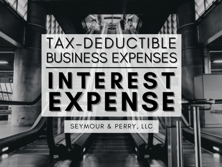 'Tax-Deductible Business Expenses: Interest Expense | Seymour & Perry, LLC' overlays a black-and-white wide shot of an ascending escalator.
