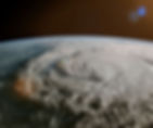 A swirling hurricane over Earth seen from space, with a dramatic cloud pattern. The planet's curve and a dark sky add to the intense mood.