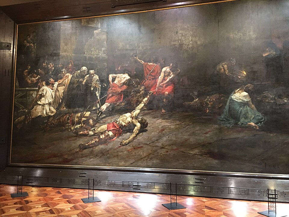 Large dark historical painting of crucifixion scene, with red-robed figures and fallen bodies in a dim museum gallery.