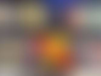 Shelves display colorful rolled and folded fabrics with labels, and vibrant yarn pom-poms. The mood is cheerful and lively.