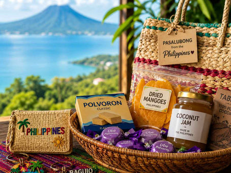 Philippine souvenir basket with dried mangoes, coconut jam, polvoron and keychains, with volcano and sea in background.