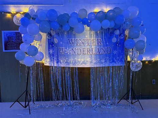 Photo 1: Banner welcoming students to the dance