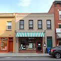 Make a picture that looks like a real photo of a storefront. this could be any sort of bui