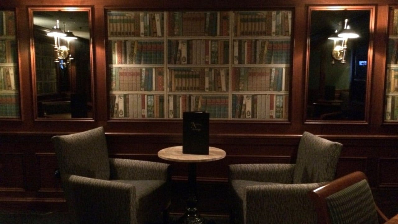 The Armory Lounge Library Nook with Bookcase Backdrop