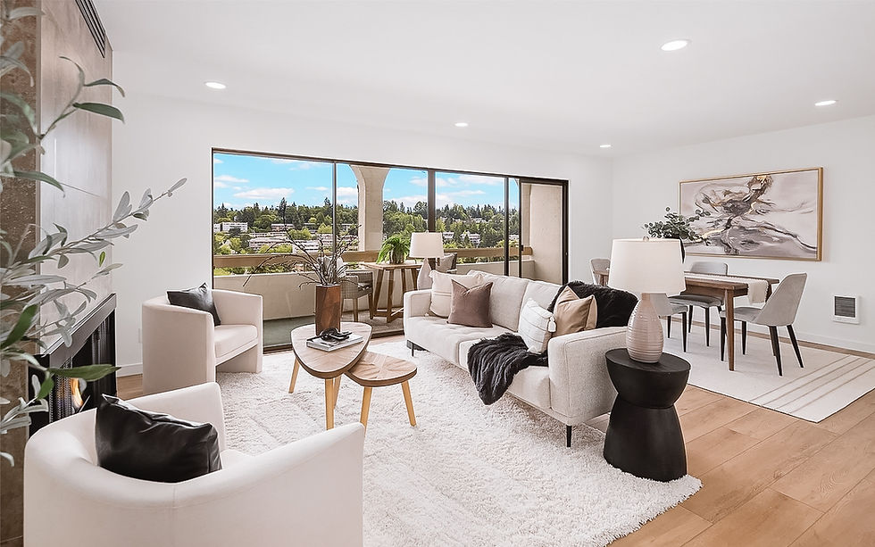 Modern staged living room and dining room with neutral colors. Staged by First Impressions Staging + Design.