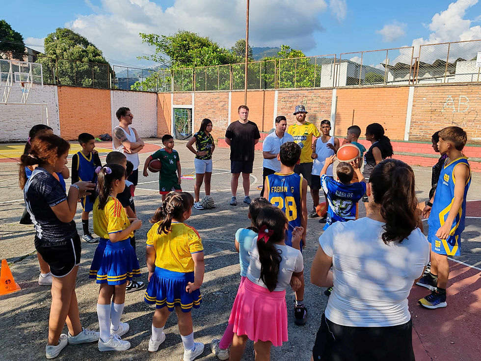 Group of students playing basketball with children at Bucara Spanish Academy in Colombia