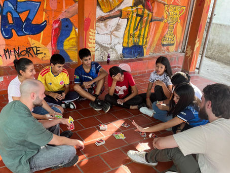 Volunteers in Colombia with a group of children in educational activities
