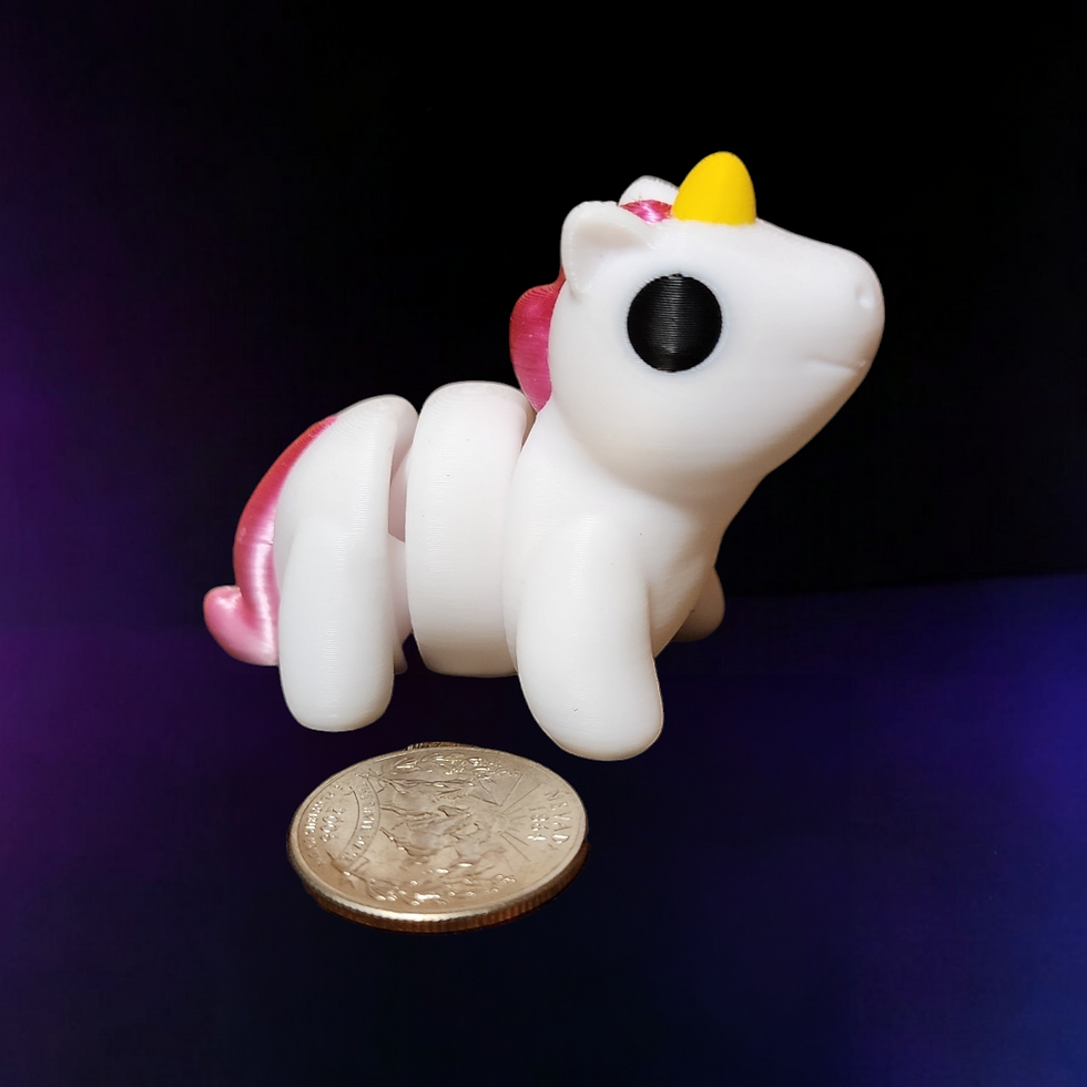 unicorn next to quarter for size comparison