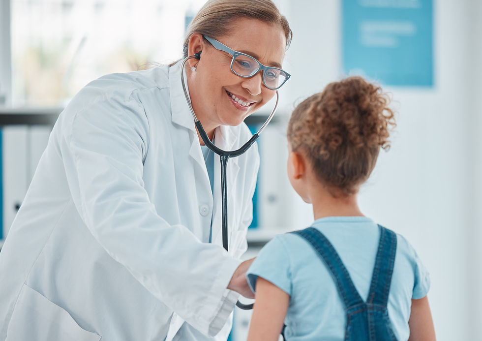 Photo of a pediatrician examining a young girl.