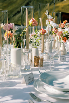 Long wedding table taper candles and bud vases outdoor wedding