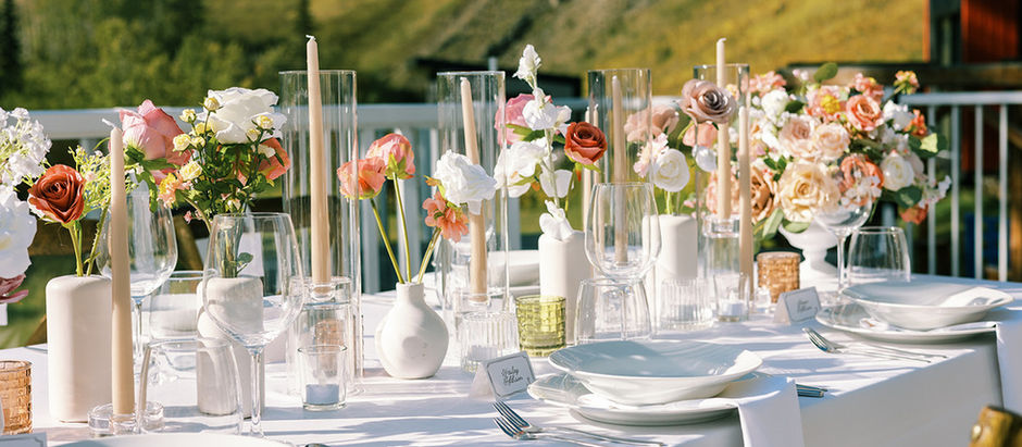 Outdoor wedding with candles and bud vases
