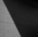 man in black jacket and pants standing near gray wall_edited_edited.jpg