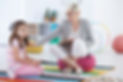 A child and family therapist comforts an unhappy child | Reunification Counselling | Bright Star Counselling. Pediatric therapy clinic based in Port Moody BC. Serving families in person and remotely across British Columbia