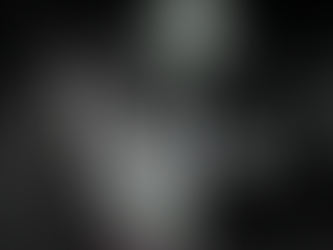 Mickey Fingers and Celeste Violet in lab coats stand in a dim lab with glowing flasks. A bright light shines above, casting dramatic shadows. Text reads VELVET UMBRELLA RADIO: After Hours, Spellwork At The Threshhold.