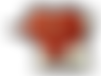 A smiling, cartoon heart character with big green eyes holds a fork. It stands on a colorful, speckled ground, radiating joy.