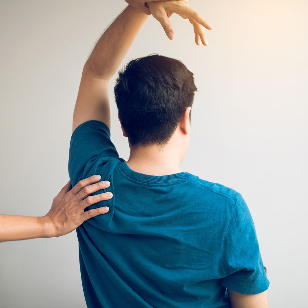 Practitioner performing osteopathy in Brantford Ontario on a patient's shoulder.