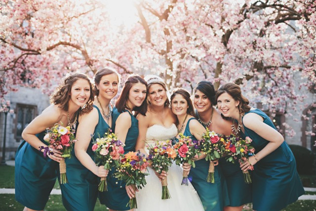 The bridesmaids bouquets beautifully complemented the teal bridesmaids dresses