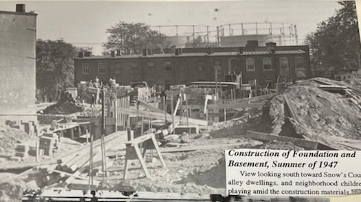 A southern view of the seven rows in 1947 with the two gas tanks looming over their rooflines. (GWU Gelman, 1947)