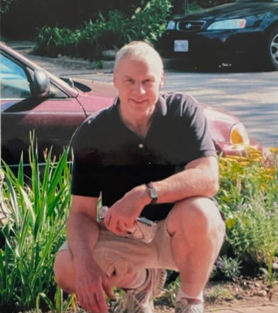Owner Ron Somers by tree garden in front of 2433 I St, (Spring 2010, S. Timlin)