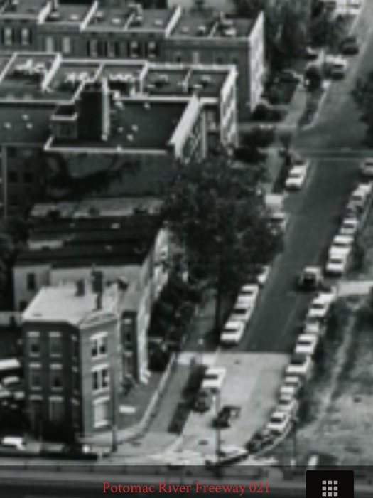 The 26th St. entrance to Queen Anne's lane is visible in the photo. Most of the structures on the street were demolished. (DDOT image, #21)