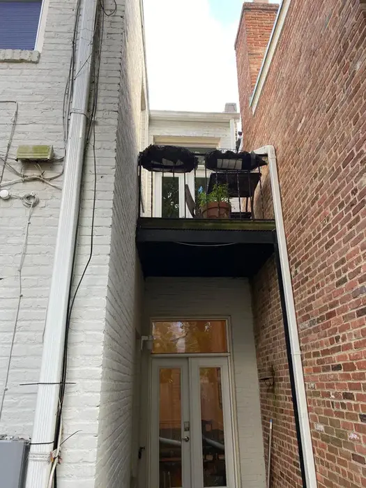 2431 I St rear upper balcony and lower doors to brick patio area, realtor photo, 2020