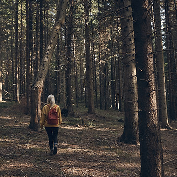 Woman Walking in Forest