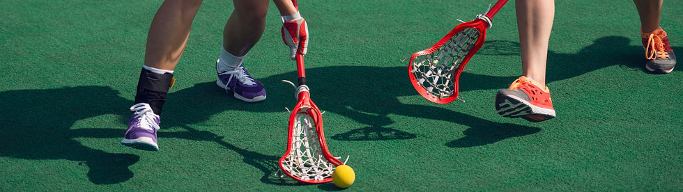 women's lacrosse player on the field.jpg