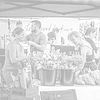 People at a flower stand, smiling faces at market