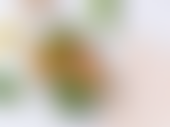 Glass container with grilled chicken, sweet potato, broccoli, and snap peas. Lemon slice, meal plan sheet on marble surface. Bright, healthy vibe.