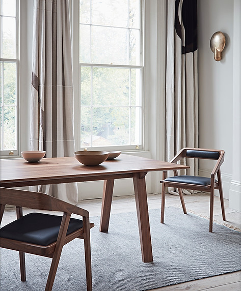 Norton dining table and kataakana chairs in walnut by DARE