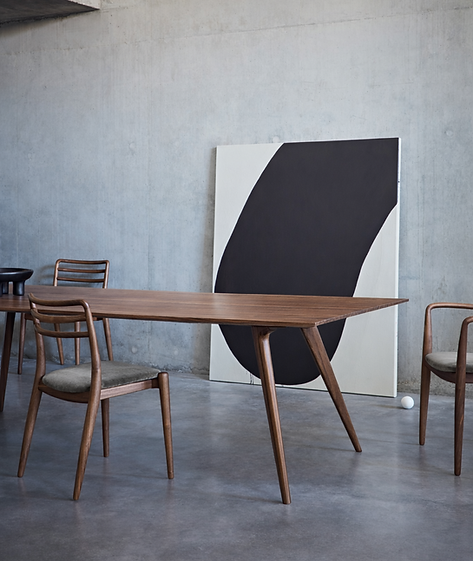 Waldron dining table and Tor dining chairs in walnut by DARE