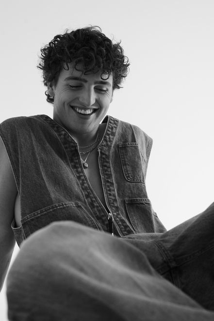Singer and songwriter Benson Boone wearing TOGA Archives denim jumpsuit, stylist Millie Cullum