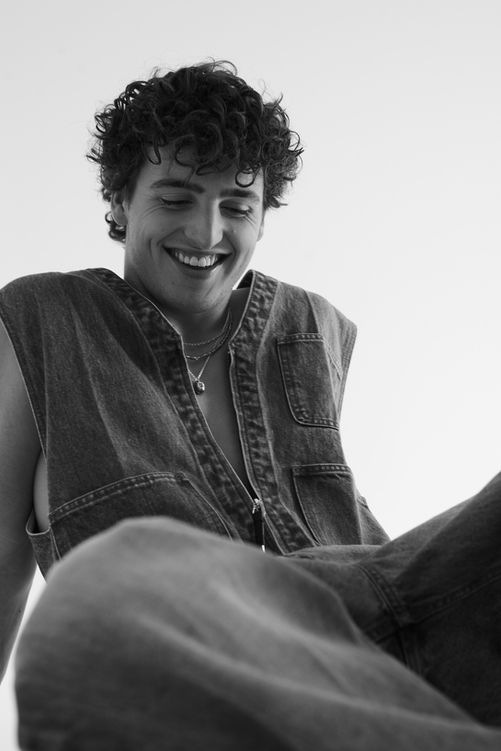 Singer and songwriter Benson Boone wearing TOGA Archives denim jumpsuit, stylist Millie Cullum