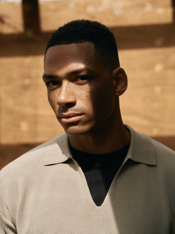 Portrait image of man standing in the sunlight for Revolut Airport campaign, stylist Millie Cullum
