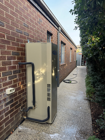 Ivanhoe plumber istalling new hot water system in residential home