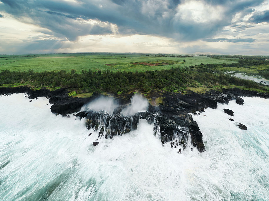 Mauritius beach with waves hiting the rocks