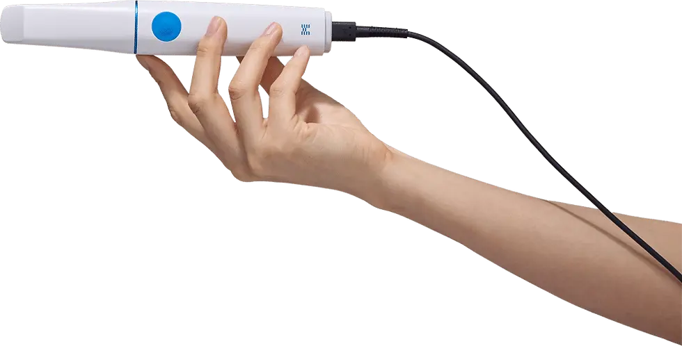 Hand holding a white Medit i900 intraoral scanner with a blue button, attached to a black cable against a plain background. Mood is neutral and focused.
