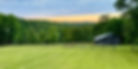 Lush green arkansas landscape, old wooden barn, green pasture and rolling hills