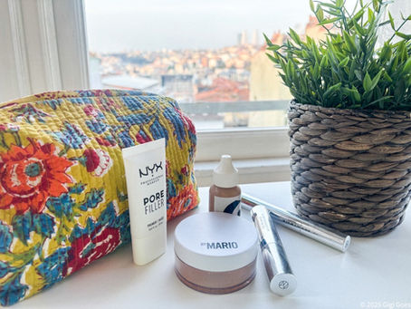 A makeup bag and some makeup products with Istanbul in the background