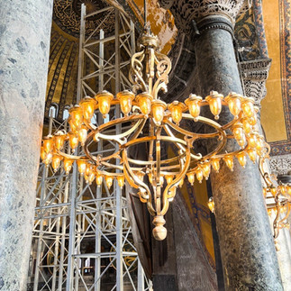 Iron chandeliers hang from the ceiling of the Hagia Sophia.