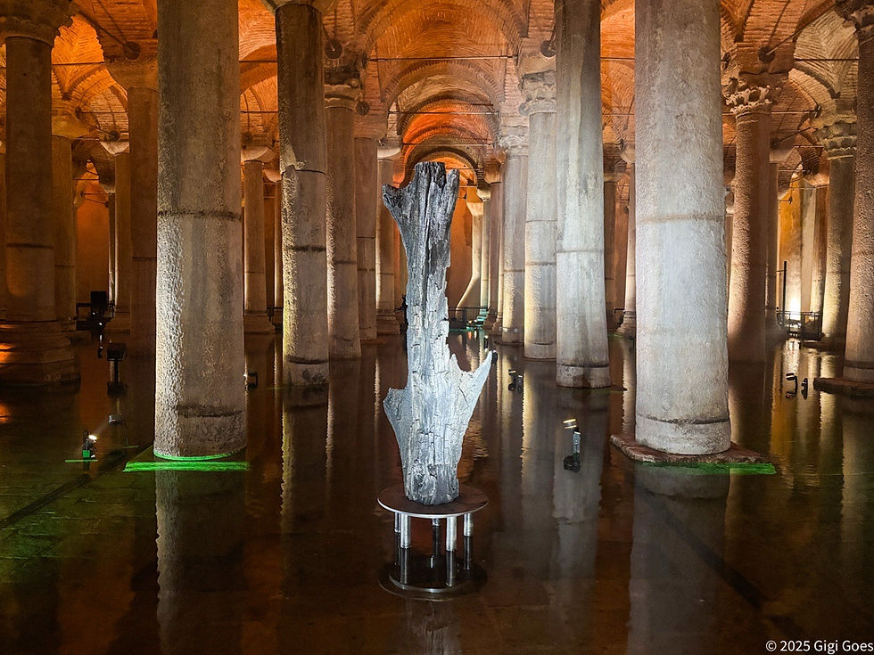 Ancient stone columns in the underground Basilica Cistern with a fossilized tree trunk sculpture. Warm lighting accentuates the arches. Istanbul.