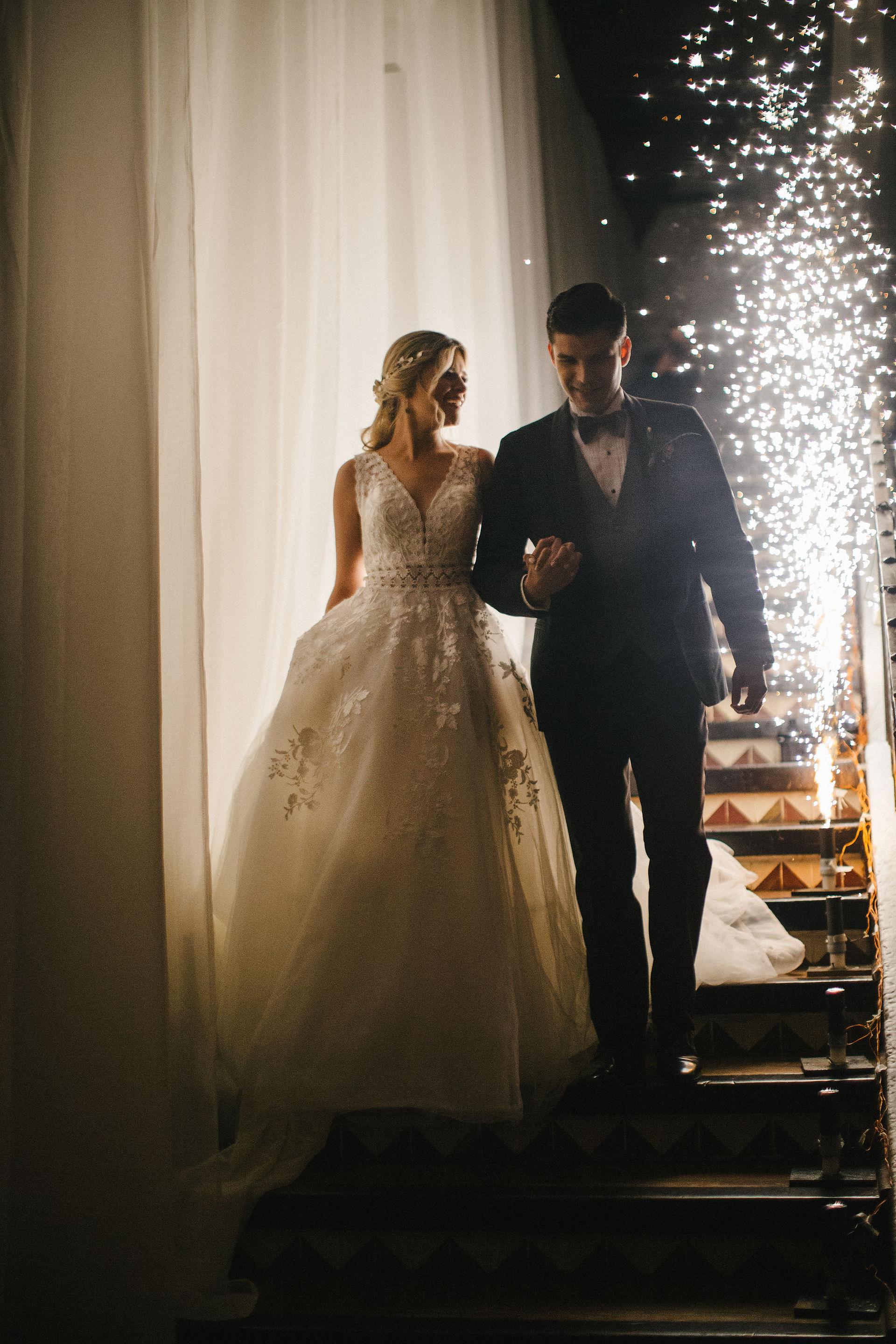 Bride and groom making their entrance to their luxury wedding in Casa Santo Domingo, lavish venue in Antigua Guatemala. 