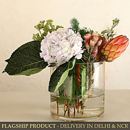 Thumbnail: Serene Hydrangea And Cape Protea In Glass Vase