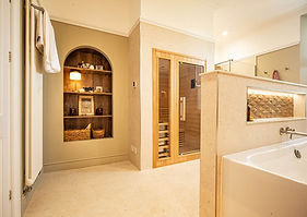A luxury bespoke wetroom with architectural lighting installed in South Wales by Thomas Vaughan Ltd