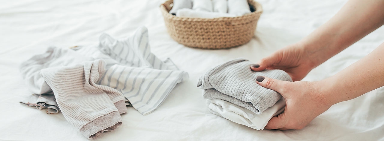 organizing laundry in a basket